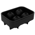 Silicone skull-shaped ice mold tray with irregular ice cubes, ideal for home bars and summer parties.