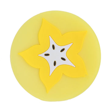 Carambola-shaped silicone coaster and placemat for drinks, designed for kids and babies, featuring vibrant fruit shape and kitchen use.