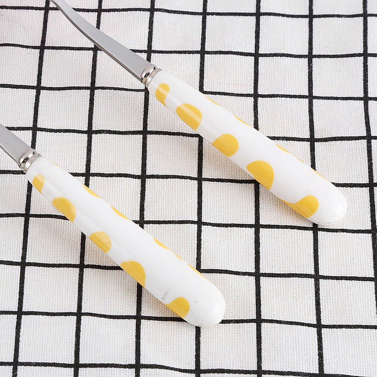 Two-piece stainless steel kid's flatware set with yellow handles, including knife, fork, and spoon in a box for children pretend play.