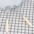 Two-piece stainless steel kids' flatware set with yellow handles, includes knife, fork, spoon in a box, designed for children.