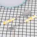 Set of 2 stainless steel kids' flatware including knife, fork, and spoon in yellow box, ideal for pretend play and mealtime.