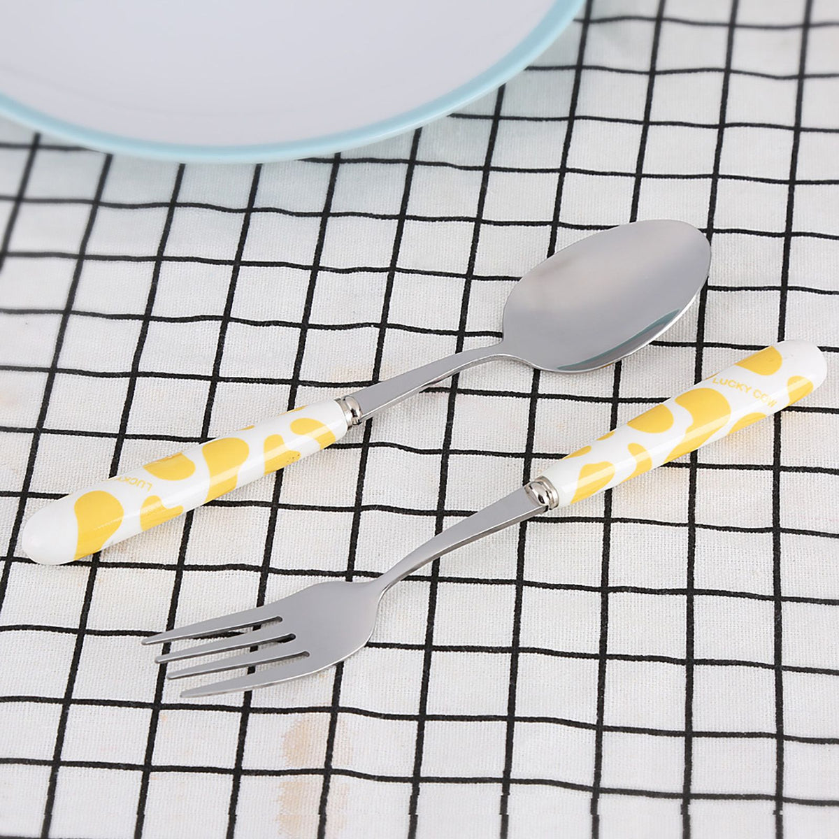 Set of 2 stainless steel kids' flatware including knife, fork, and spoon in yellow box, ideal for pretend play and mealtime.