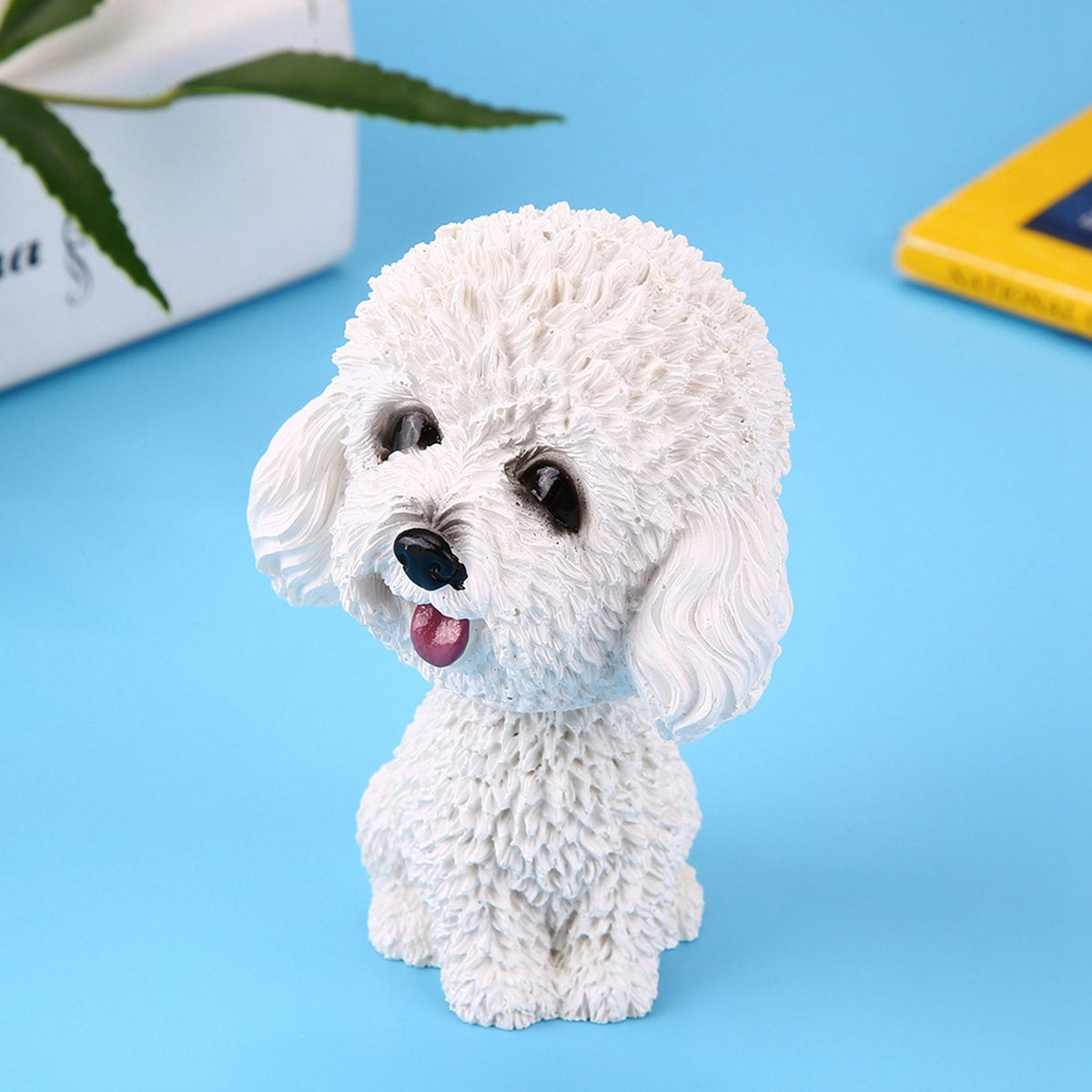 White dog-shaped bobble head toy for car dashboard decor, designed as a playful shake-head ornament for kids' ride-on cars.