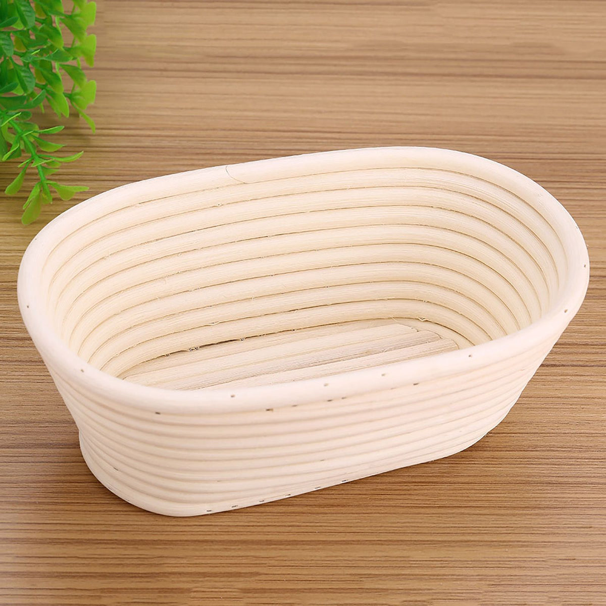 Handmade unbleached natural cane banneton proofing basket for bread dough, 21x13.5x8cm, used in bread baking and proofing.