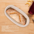 Handmade unbleached natural cane banneton proofing basket for dough, 25x14.5x8cm, used for bread baking.