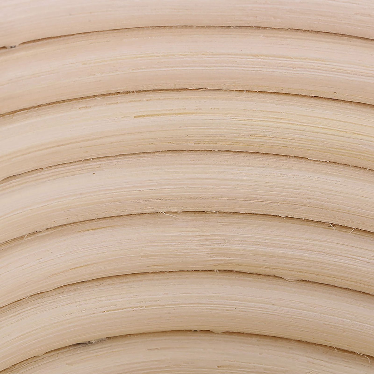 Handmade unbleached natural cane banneton proofing basket for bread dough, 25x14.5x8cm, used in bread baking.