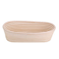 Handmade unbleached natural cane banneton proofing basket for bread dough, 27.5x14x8cm, with woven texture and round shape.