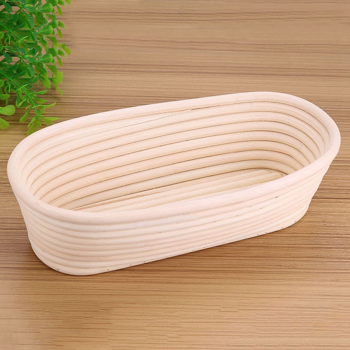 Handmade unbleached natural cane banneton proofing basket for bread dough, 27.5x14x8cm, used in bread baking.