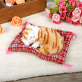 Yellow plush sleeping kitten toy from Everything Baby with realistic sound, perfect for pretend play and Christmas gifts.