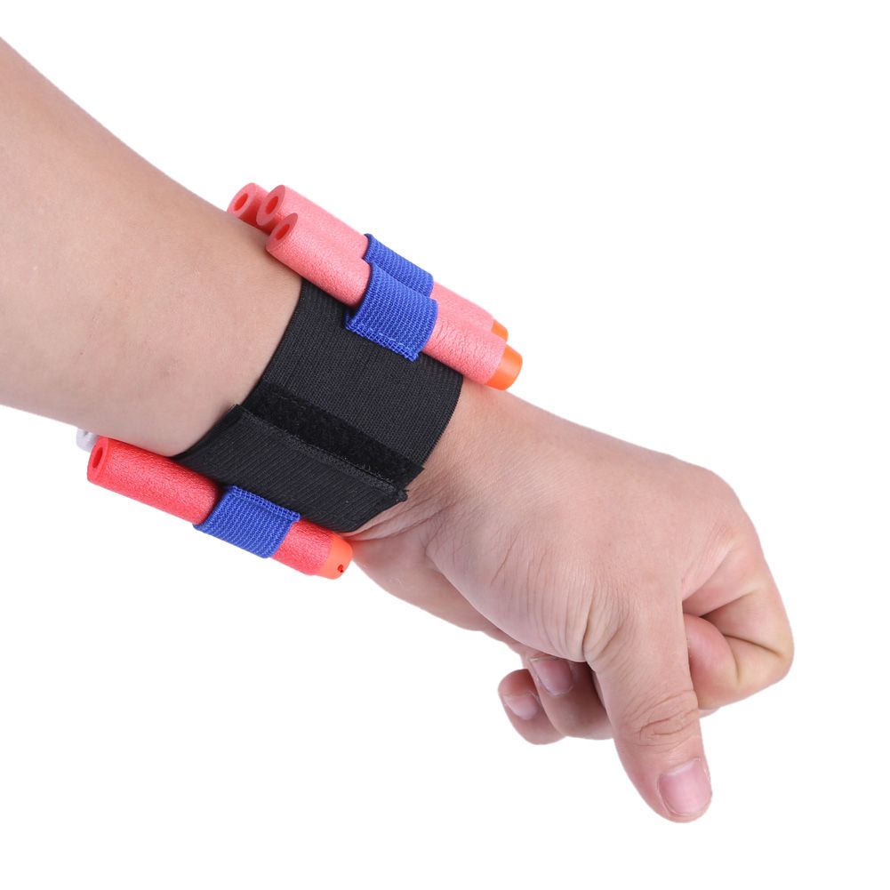 Child wearing a toy gun wristband with soft bullets, part of outdoor play equipment from Everything Baby, designed for kids' outdoor fun.