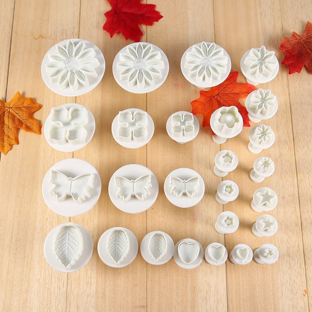 Set of 46 flower fondant cake decorating tools and cutters from Everything Baby, used for sugarcraft cake decoration.