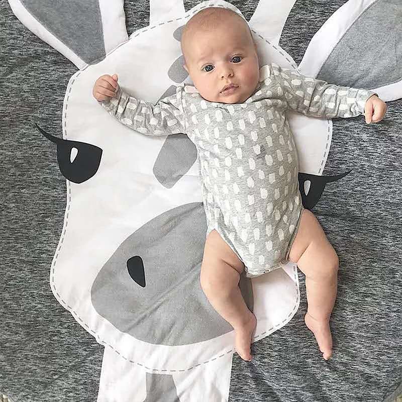 Play mat for babies featuring cute cartoon animal designs, made of soft cotton, ideal for crawling and pretend play.