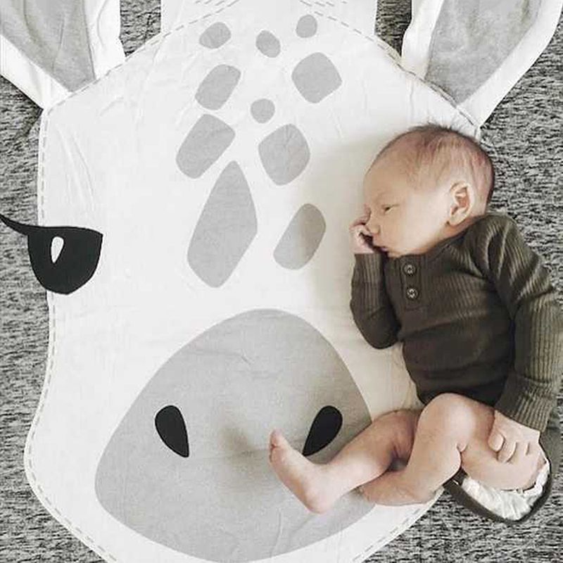 Colorful cotton baby play mat with cute cartoon animal designs, perfect for crawling and pretend play for children.