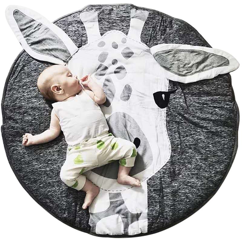 Colorful cotton baby play mat with cute cartoon animal designs, perfect for crawling and pretend play for children.