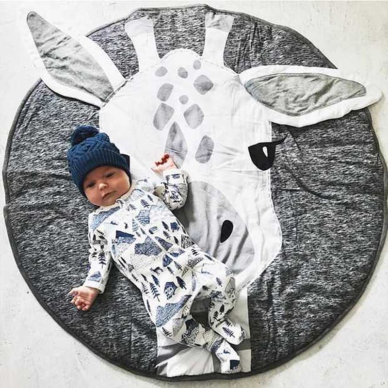 Colorful baby play mat with cute cartoon animal designs, made of cotton, perfect for crawling and pretend play for children.