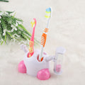 Pink children's toothbrush holder with hourglass timer for 3-minute countdown, part of baby and kids grooming kit.
