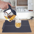 Grey rectangle silicone drain mat from Everything Baby, heat resistant and slip-proof dish drying tray for baby feeding accessories.