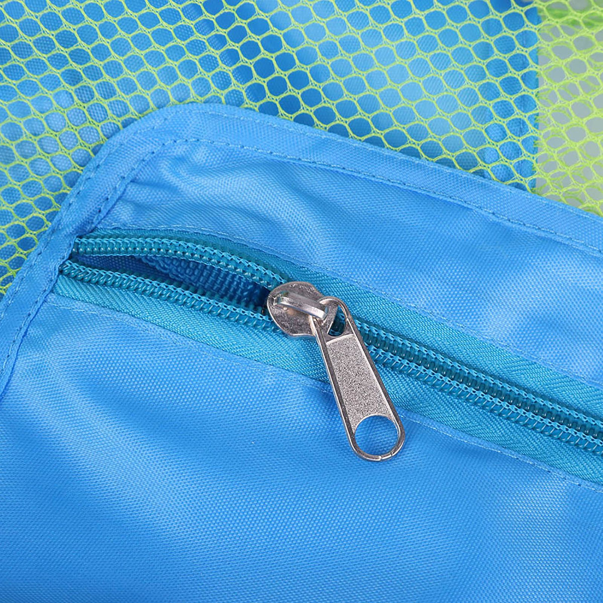 Blue mesh drawstring backpack for kids with shell toy storage, ideal for outdoor beach play and outdoor toy organization.