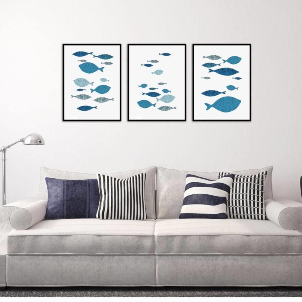 Three-piece canvas wall art featuring colorful cartoon fish prints, perfect for baby's nursery or kids' room decor.