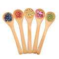 Set of 30 mini natural wooden children spoons for kids' play and kitchen use, from Everything Baby.