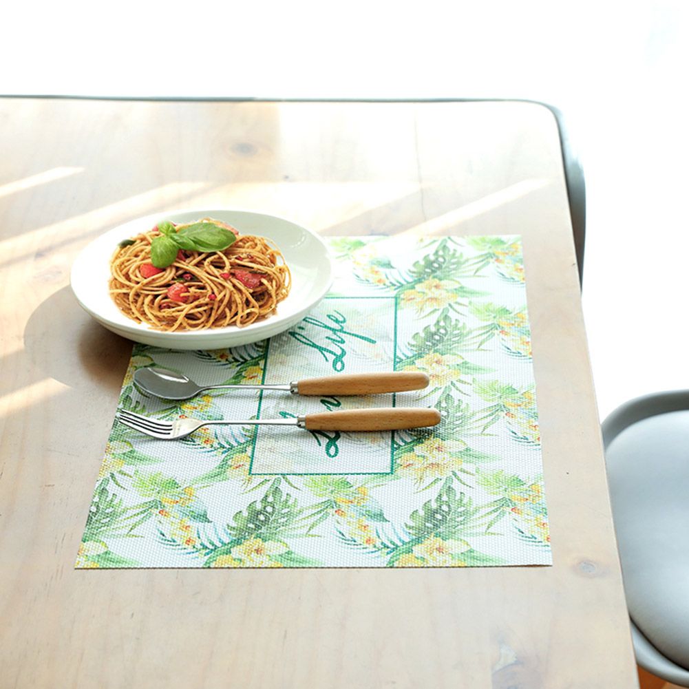 Colorful PVC placemat for kids' dining, featuring non-slip surface and insulation pad, ideal for safe, stylish table settings.