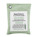 Light green bamboo air purifying bag with activated charcoal, designed for odor removal in cars and small spaces.