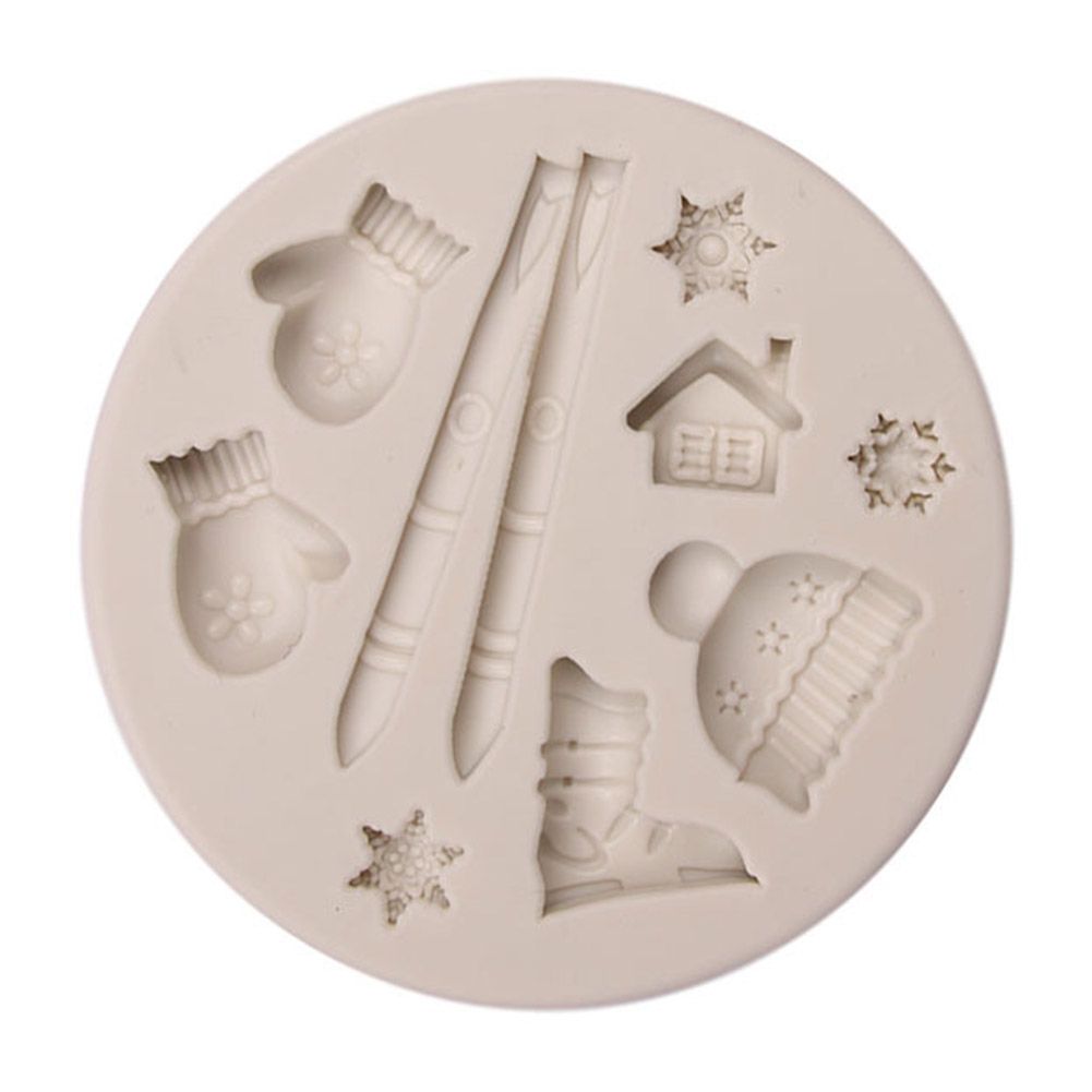Silicone cake mold featuring Christmas-style deer, pine cone, and bear shapes for DIY baking, by Everything Baby.