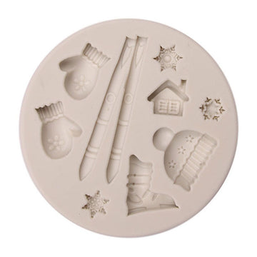 Silicone cake mold featuring Christmas-style deer, pine cone, and bear shapes for DIY baking, by Everything Baby.
