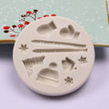 Silicone cake mold featuring Christmas deer, pine cone, and bear shapes for DIY holiday-themed baking, by Everything Baby.