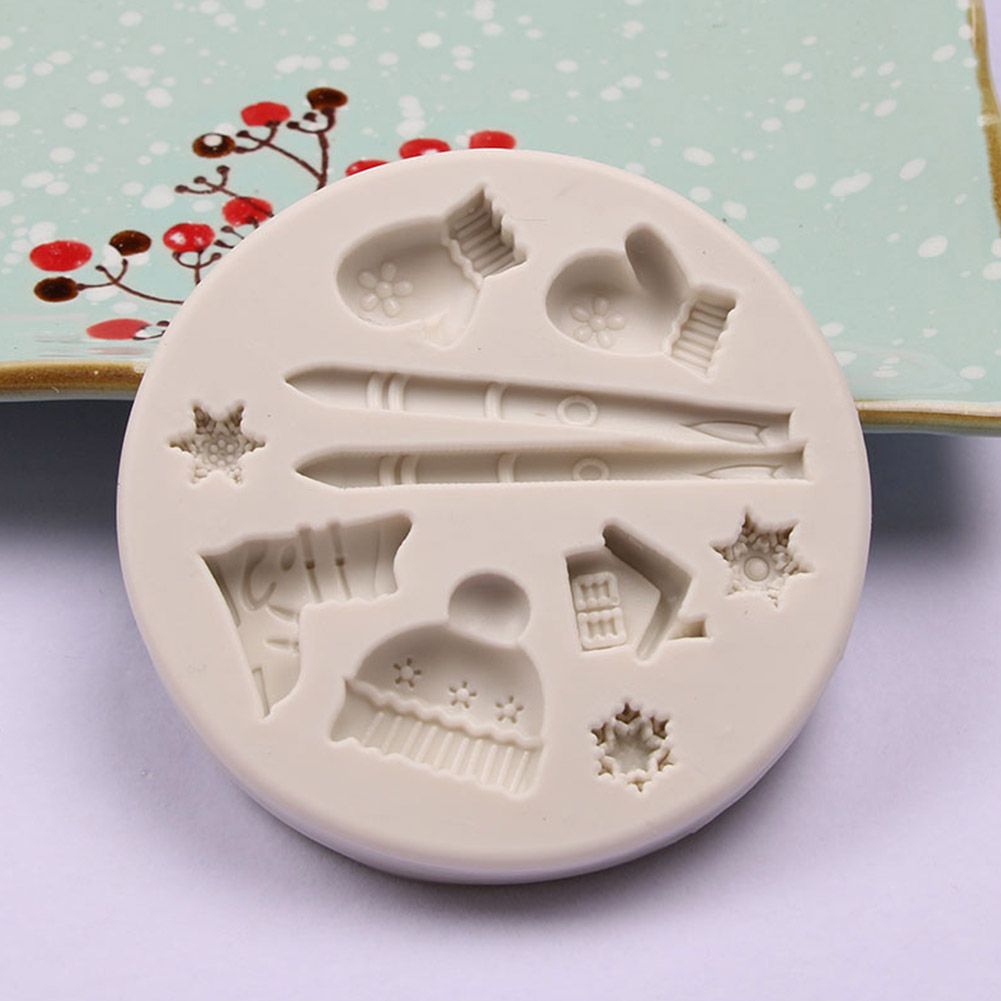 Silicone cake mold featuring Christmas deer, pine cone, and bear shapes for DIY holiday-themed baking, by Everything Baby.