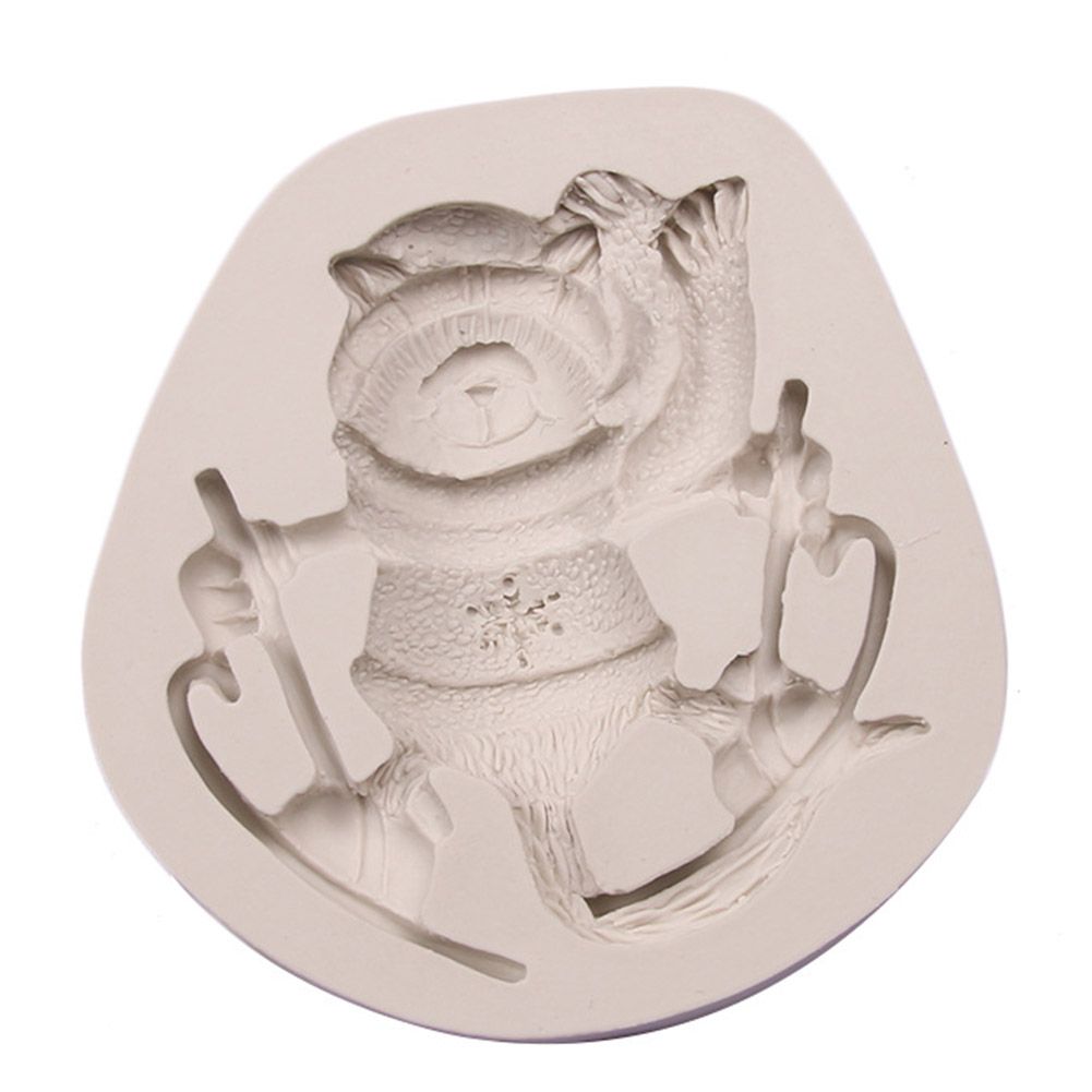 Silicone cake mold featuring Christmas-themed deer, pine cone, and bear designs for DIY holiday baking and cake decorating.