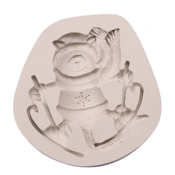 Silicone cake mold featuring Christmas-themed deer, pine cone, and bear designs for DIY holiday baking and cake decorating.
