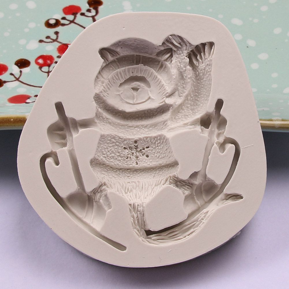 Silicone cake mold featuring Christmas-themed deer, pine cone, and bear designs for DIY baking, by Everything Baby