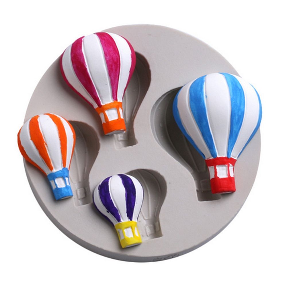 Silicone mold with hot air balloon pattern for fondant cake decorating, designed for baking and cake decorating projects.