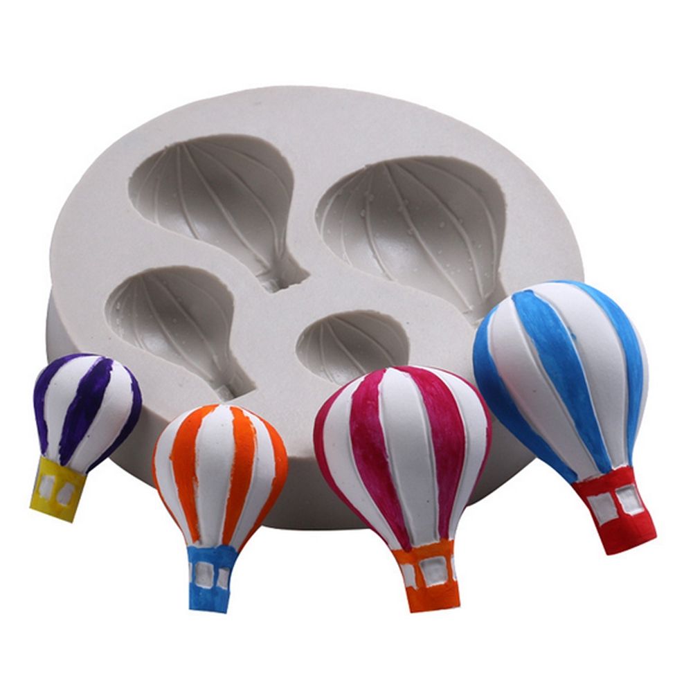 Silicone mold with hot air balloon pattern for fondant cake decoration, suitable for baby and kids' pretend play baking projects.