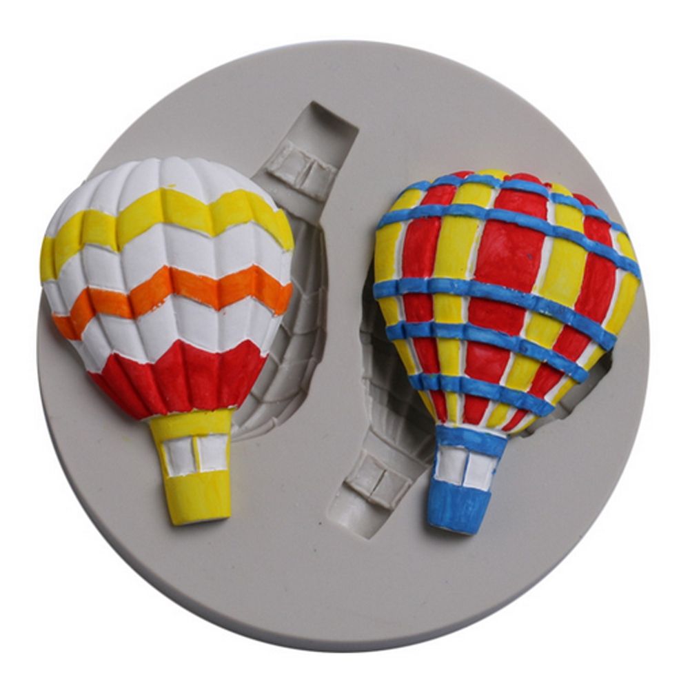 Silicone mold with hot air balloon pattern for fondant cake decorating, ideal for baking and cake decorating projects.