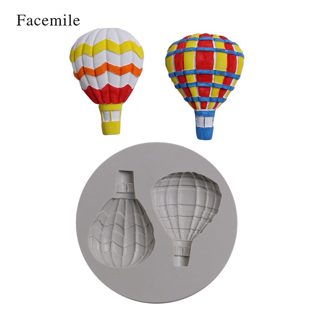 Silicone mold with hot air balloon pattern for fondant cake decorating, suitable for baking and cake decorating projects.