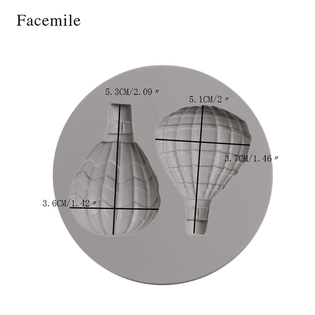 Silicone mold with hot air balloon pattern for fondant cake decoration, suitable for baking and cake decorating projects.