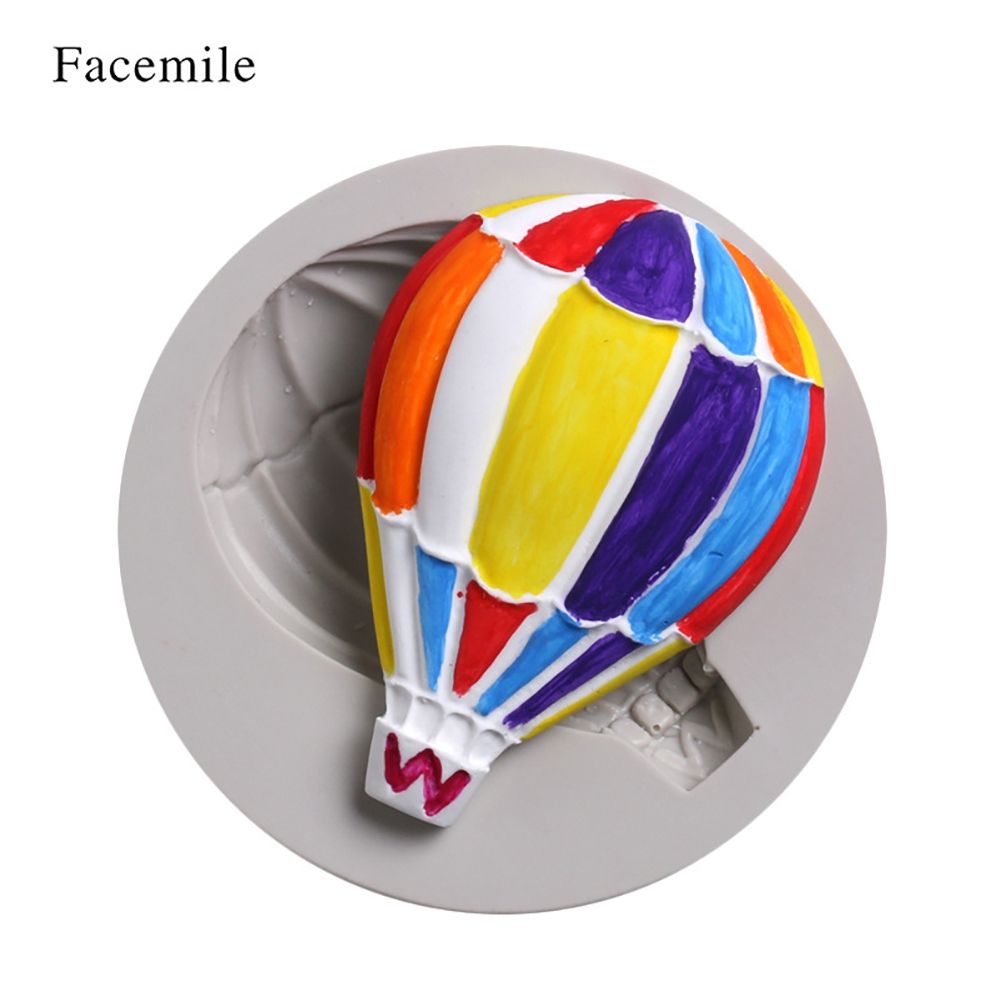 Silicone mold with hot air balloon pattern for fondant cake decorating, ideal for baking and cake decorating projects.