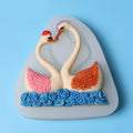 Silicone cake mold featuring a sweet couple swan pattern, ideal for baking desserts and chocolates for kids' pretend play.
