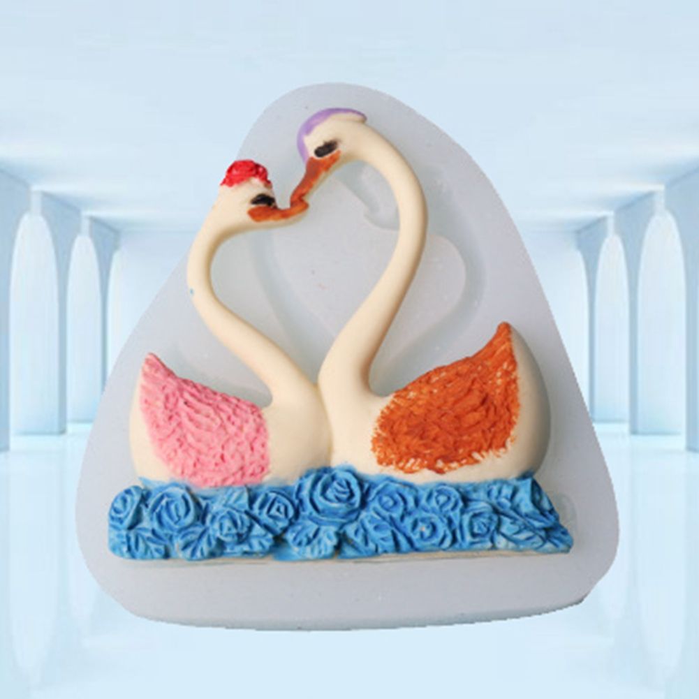 Silicone cake mold with a sweet couple swan pattern, ideal for baking desserts and chocolates, from Everything Baby.