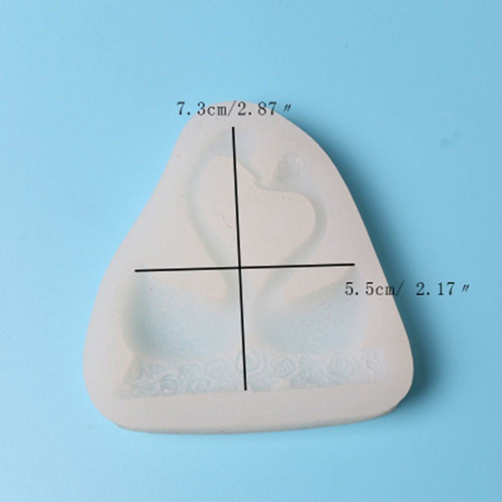 Silicone cake mold featuring sweet couple swan pattern, ideal for baking desserts and chocolates, by Everything Baby