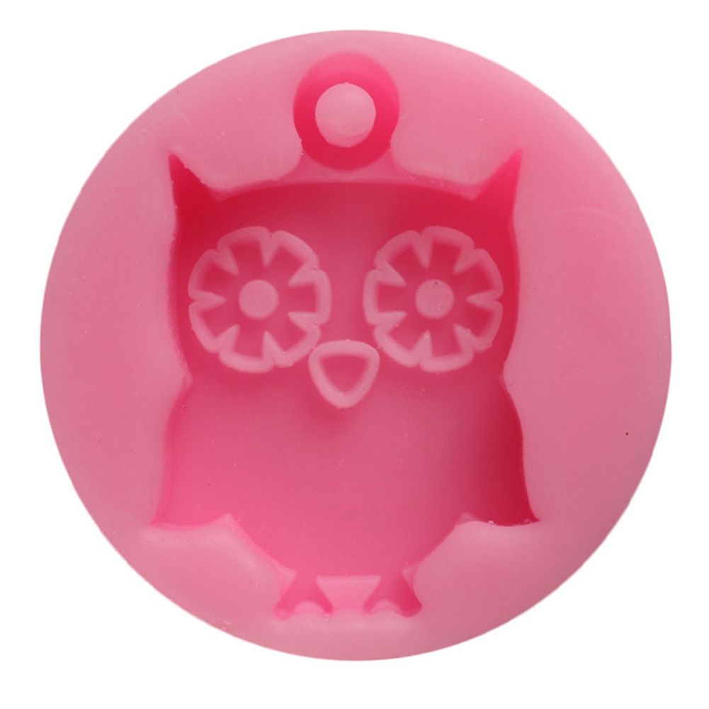 Cute owl-shaped silicone mold for baking cookies and cake decorations, ideal for kids' pretend play and baking projects.