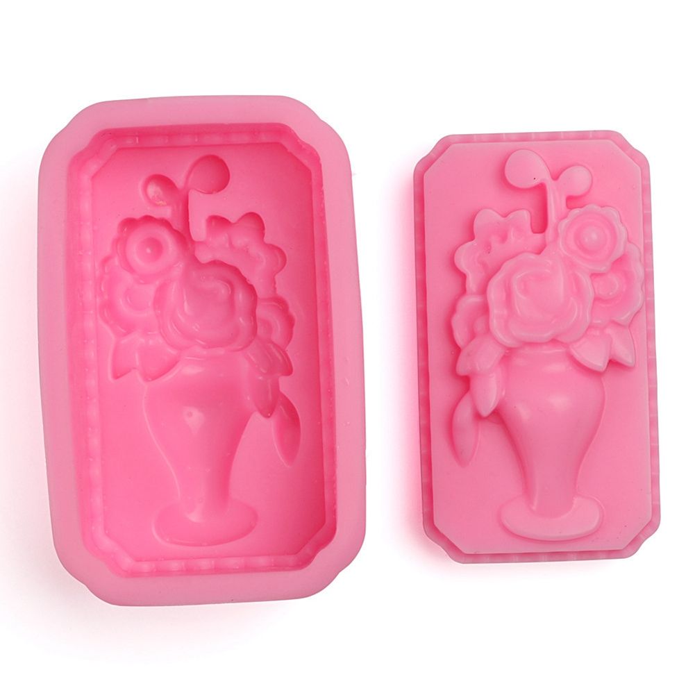 Silicone mold in vase shape for baking or cake decorating, featuring detailed flower patterns, ideal for kids' pretend play food.