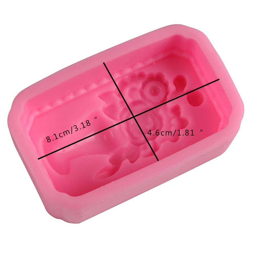 Silicone mold shaped like a baby toy for baking and cake decorating, designed for creating pretend play food and treats.