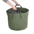Portable waterproof canvas tote for garden leaf waste, reusable trash bag container, ideal for outdoor play and gardening storage.