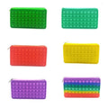 Orange silicone bubble toy pencil case for kids, soft sensory storage bag with decompression bubbles and playful design.