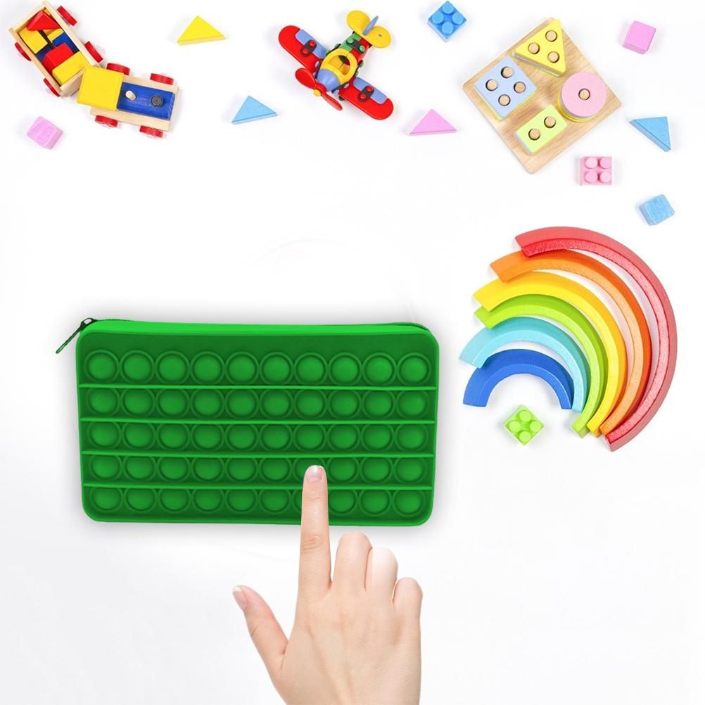 Mint green silicone bubble pencil case for kids, sensory toy and stationery storage bag with decompression bubble design.