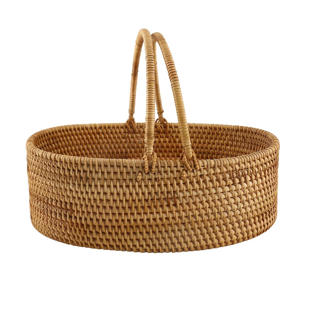 Rattan woven basket for holding fruits, flowers, or toys, with an oval wicker design, suitable for home, outdoor, or picnic use.