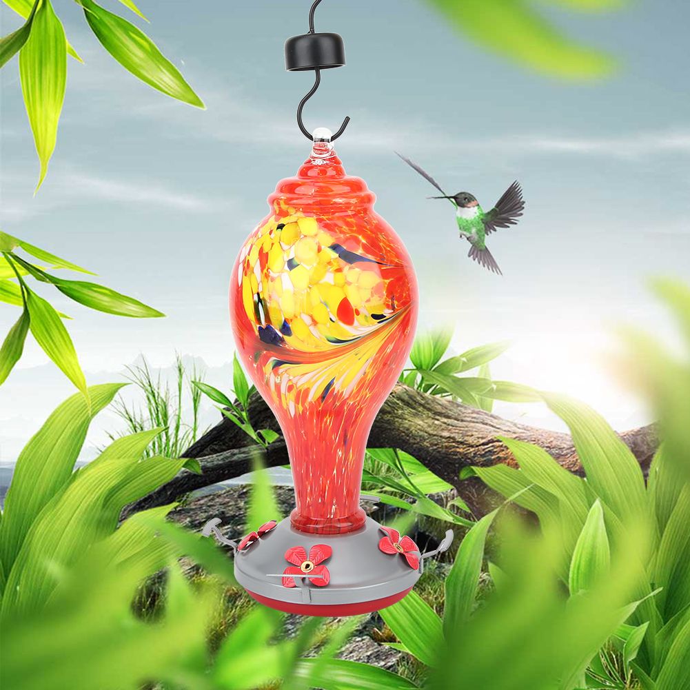 Colorful glass bird feeder with hummingbird design, suitable for outdoor gardens and courtyards, enhances outdoor bird watching.